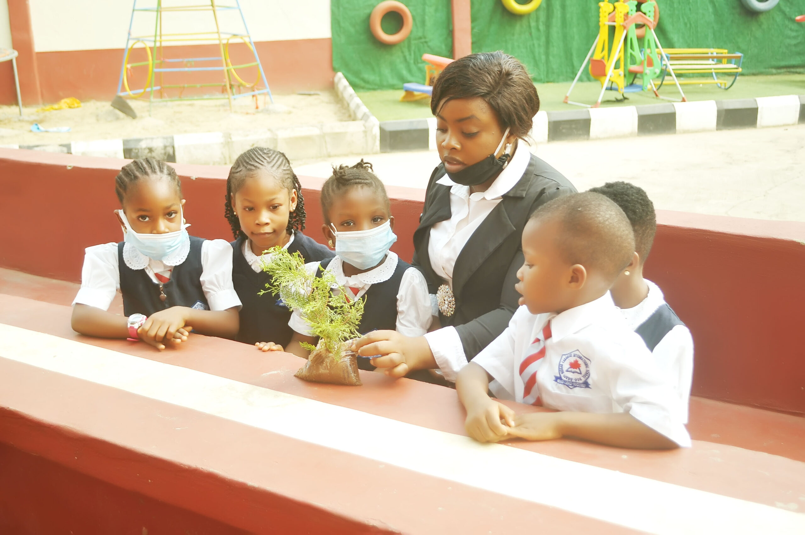 Teacher with her pupils during a field experiment